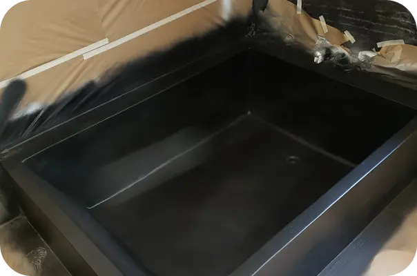 Black refinished bathtub in Home – modern high-gloss finish after professional bathtub reglazing