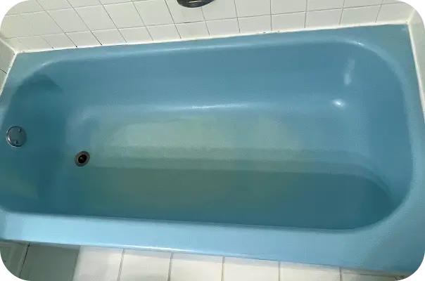 Blue refinished bathtub in Home – smooth glossy surface showcasing custom reglazing color